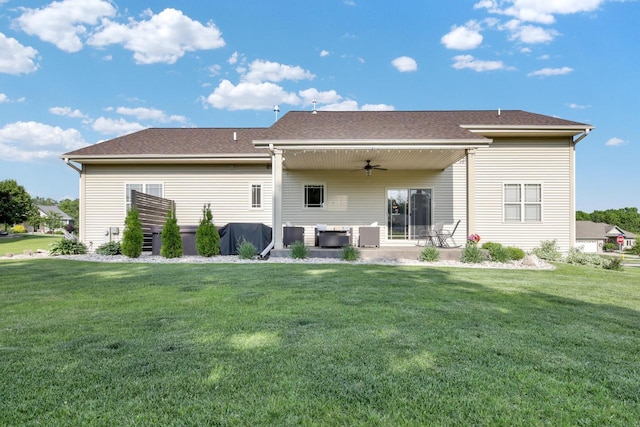 1395 American Eagle Dr, Slinger, WI 53086 - back of house with a ceiling fan, a lawn, an outdoor hangout area, and a patio area