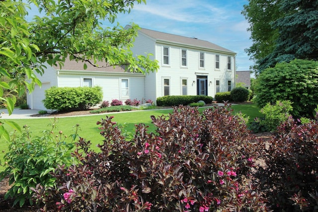 1000 Ridge Rd, Waukesha, WI 53186 - colonial home with a front lawn and an attached garage