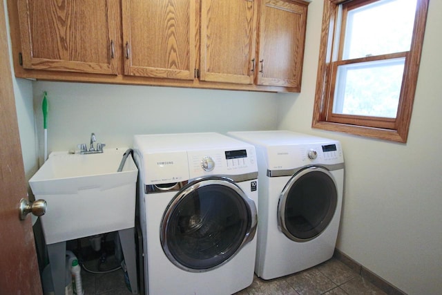 1000 Ridge Rd, Waukesha, WI 53186 - laundry room with cabinet space, washer and clothes dryer, and tile patterned floors