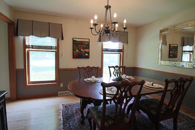 1000 Ridge Rd, Waukesha, WI 53186 - dining space with plenty of natural light, light wood-type flooring, and a chandelier