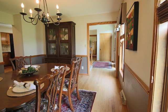 1000 Ridge Rd, Waukesha, WI 53186 - dining room with light wood-style floors and a chandelier