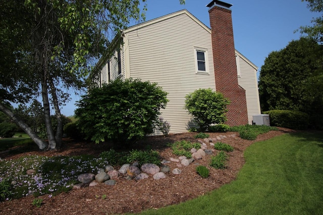 1000 Ridge Rd, Waukesha, WI 53186 - view of home's exterior with a chimney and a yard