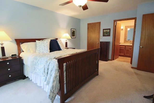1000 Ridge Rd, Waukesha, WI 53186 - bedroom with light carpet, ceiling fan, and connected bathroom