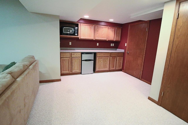 1000 Ridge Rd, Waukesha, WI 53186 - bar with refrigerator, black microwave, recessed lighting, and light colored carpet