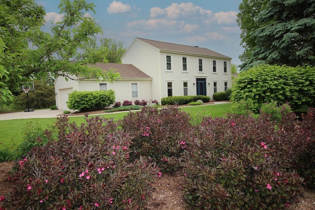 1000 Ridge Rd, Waukesha, WI 53186 - colonial inspired home featuring a front yard, an attached garage, and driveway