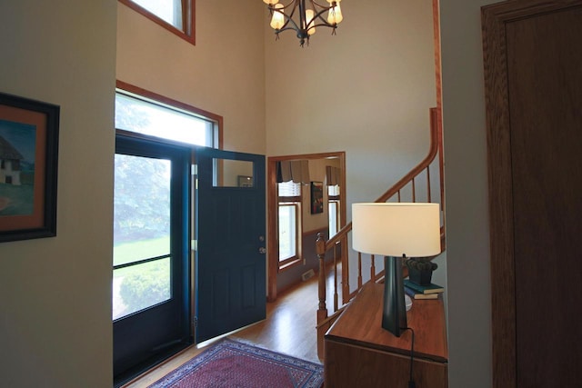 1000 Ridge Rd, Waukesha, WI 53186 - foyer entrance with a chandelier, wood finished floors, and a towering ceiling