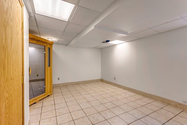 9335 W County Line Rd Unit 9325, Milwaukee, WI 53224 - finished basement with a paneled ceiling and light tile patterned floors