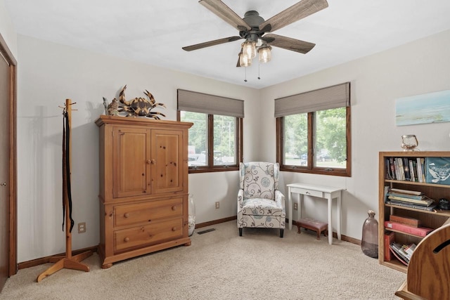 915 Nelson Ave, Milton, WI 53563 - living area with light colored carpet and ceiling fan
