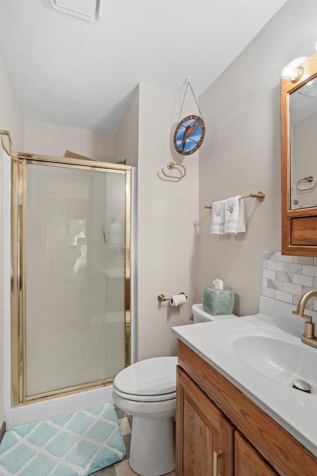 915 Nelson Ave, Milton, WI 53563 - bathroom featuring a stall shower, vanity, and decorative backsplash