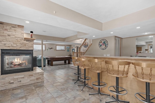 915 Nelson Ave, Milton, WI 53563 - indoor bar featuring billiards table, a fireplace, recessed lighting, and stairway