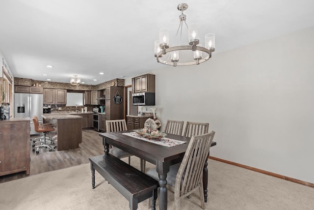 915 Nelson Ave, Milton, WI 53563 - dining room with a chandelier and baseboards