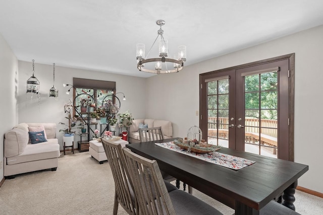 915 Nelson Ave, Milton, WI 53563 - dining space featuring french doors, light colored carpet, and a chandelier