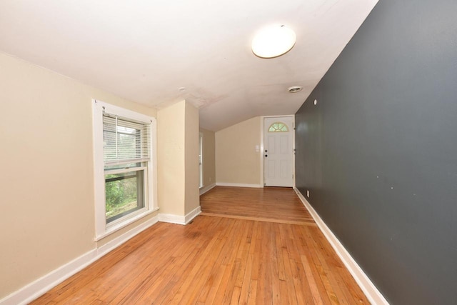 1816 N Arlington Pl Unit 1818, 1818A, Milwaukee, WI 53202 - spare room featuring vaulted ceiling and light wood-style flooring