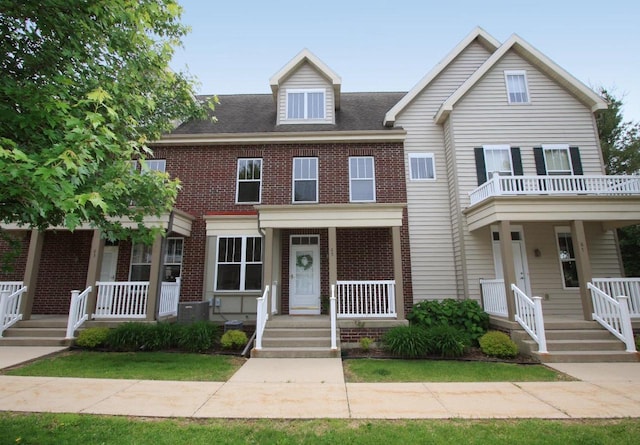 65 S Gardens Way, Fitchburg, WI 53711 - townhome / multi-family property with covered porch and brick siding