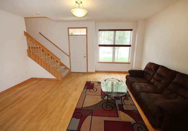 65 S Gardens Way, Fitchburg, WI 53711 - living room featuring light wood-style floors and stairway