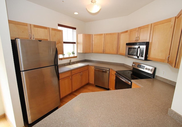 65 S Gardens Way, Fitchburg, WI 53711 - kitchen with stainless steel appliances, light brown cabinets, and light wood-style flooring