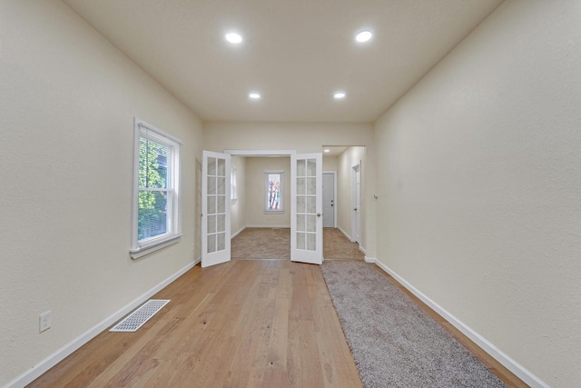 3124 N 29th St, Milwaukee, WI 53216 - spare room with french doors, light wood-style floors, and recessed lighting