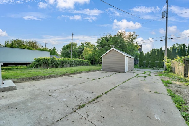 3124 N 29th St, Milwaukee, WI 53216 - view of patio / terrace featuring a storage shed and concrete driveway