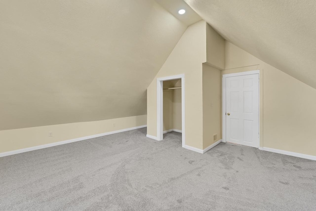 3124 N 29th St, Milwaukee, WI 53216 - bonus room featuring lofted ceiling, carpet flooring, and a textured ceiling