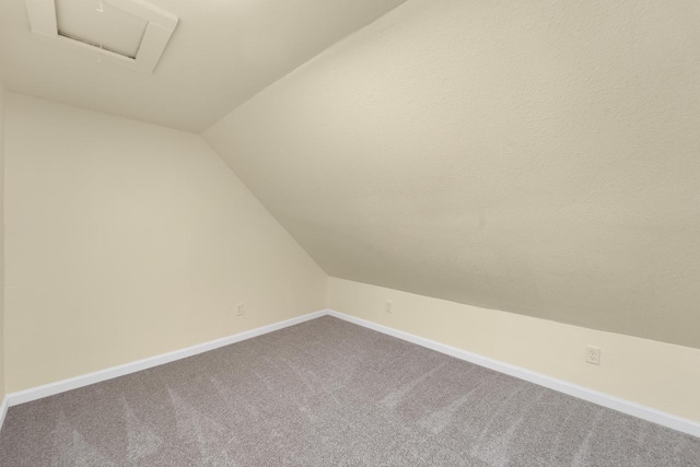 3124 N 29th St, Milwaukee, WI 53216 - additional living space with vaulted ceiling, carpet flooring, and attic access