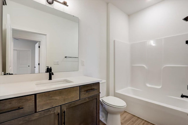 516 Hickory Hollow Rd Unit 0402, Waterford, WI 53185 - bathroom with vanity, wood finished floors, and shower / tub combination