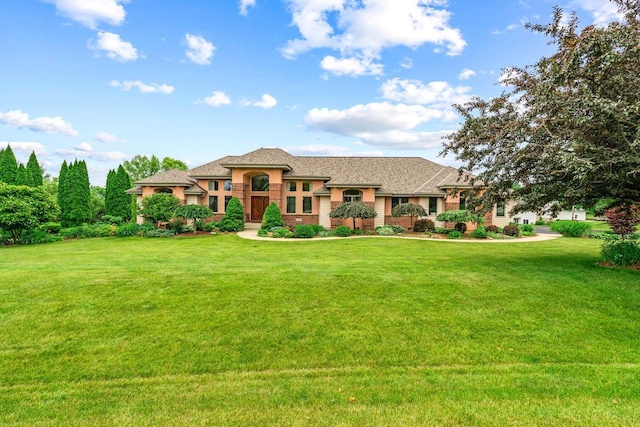 N66W38493 N Woodlake Cir, Oconomowoc, WI 53066 - view of front of home featuring a front yard