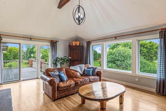 N66W38493 N Woodlake Cir, Oconomowoc, WI 53066 - living room with a chandelier and light wood-type flooring