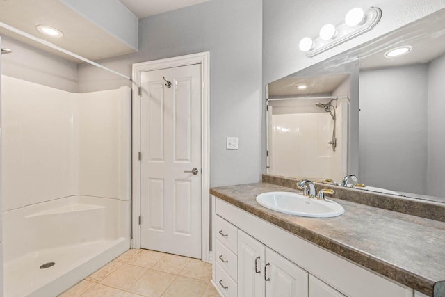 N66W38493 N Woodlake Cir, Oconomowoc, WI 53066 - full bathroom with a shower, tile patterned flooring, and vanity