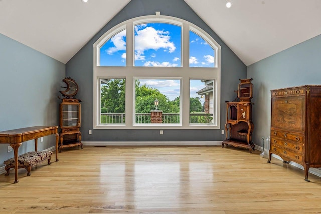 N66W38493 N Woodlake Cir, Oconomowoc, WI 53066 - sitting room featuring vaulted ceiling and wood finished floors