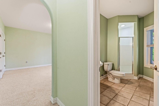 N66W38493 N Woodlake Cir, Oconomowoc, WI 53066 - full bathroom featuring toilet and a shower with shower door