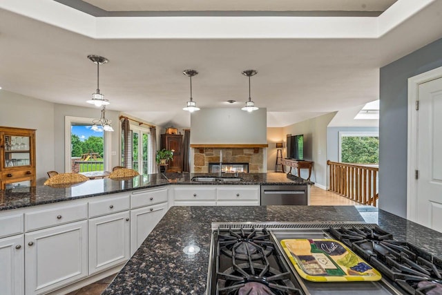 N66W38493 N Woodlake Cir, Oconomowoc, WI 53066 - kitchen with dishwasher, white cabinets, decorative light fixtures, open floor plan, and black gas stovetop