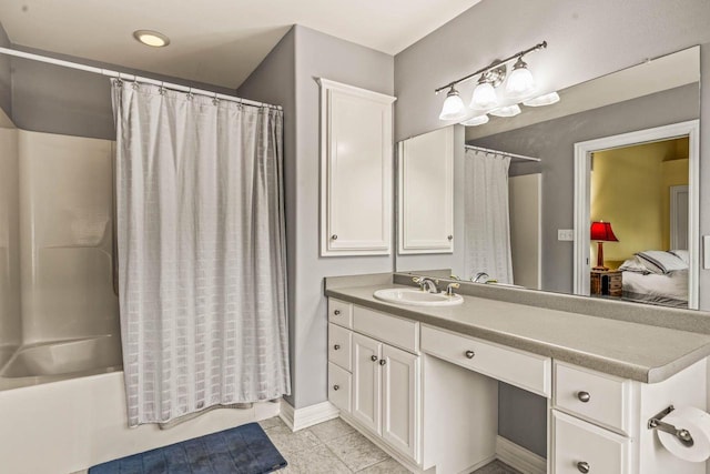 N66W38493 N Woodlake Cir, Oconomowoc, WI 53066 - ensuite bathroom featuring vanity, shower / bath combination with curtain, and tile patterned floors