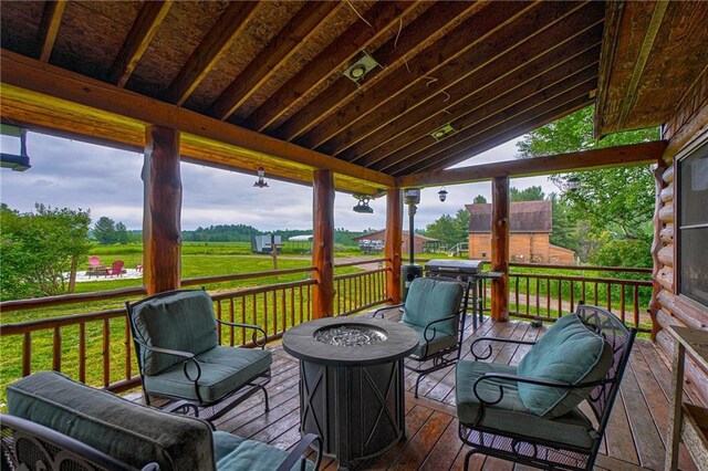 14097 W State Road 77, Hayward, WI 54843 - wooden deck featuring an outdoor fire pit and area for grilling