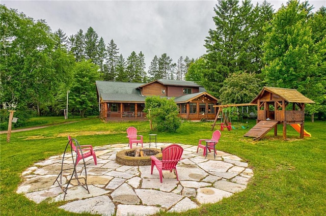 14097 W State Road 77, Hayward, WI 54843 - view of patio / terrace featuring a fire pit and a playground