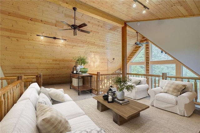 14097 W State Road 77, Hayward, WI 54843 - carpeted living area with a ceiling fan, wood ceiling, rail lighting, wooden walls, and high vaulted ceiling