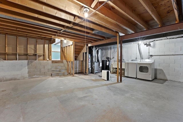 2332 Hughes Ln, Waukesha, WI 53188 - unfinished below grade area featuring washing machine and clothes dryer and stairway