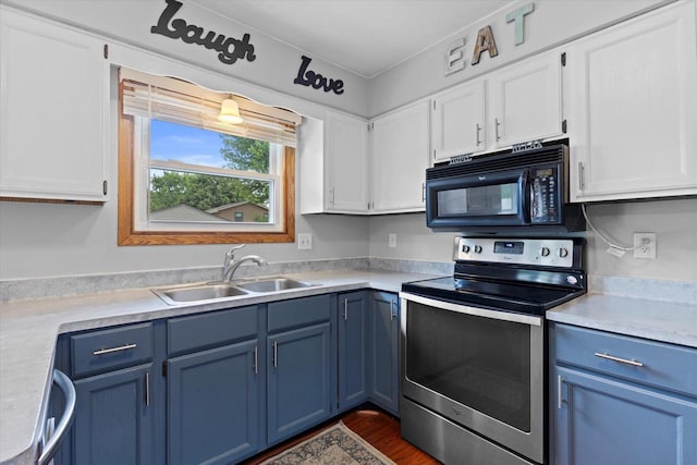 2332 Hughes Ln, Waukesha, WI 53188 - kitchen featuring stainless steel appliances, blue cabinetry, white cabinets, and light countertops
