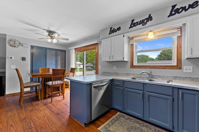 2332 Hughes Ln, Waukesha, WI 53188 - kitchen with stainless steel dishwasher, blue cabinets, a peninsula, and ceiling fan