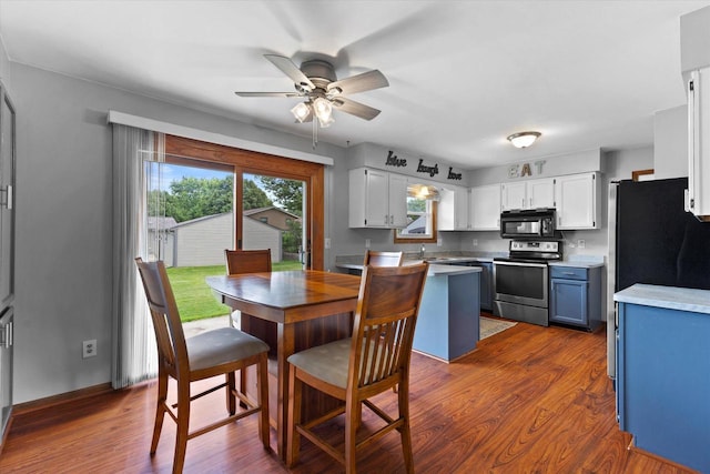 2332 Hughes Ln, Waukesha, WI 53188 - dining area with a ceiling fan and dark wood-style floors