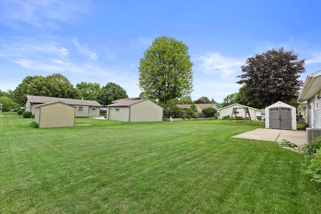 2332 Hughes Ln, Waukesha, WI 53188 - view of grassy yard featuring a storage shed and a residential view