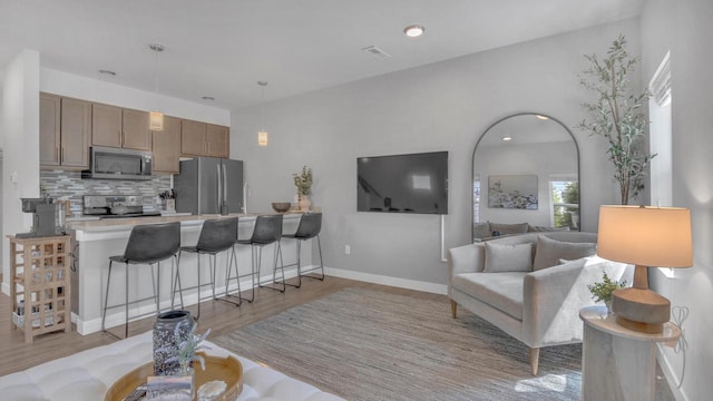 814 N 15th St Unit B, Sheboygan, WI 53081 - living area with light wood-style floors and recessed lighting