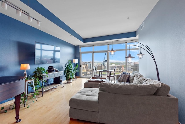 106 W Seeboth St Unit 702, Milwaukee, WI 53204 - living room with wood finished floors and expansive windows