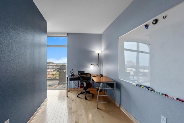 106 W Seeboth St Unit 702, Milwaukee, WI 53204 - office with wood finished floors and a textured wall