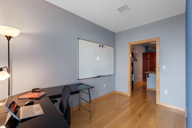 106 W Seeboth St Unit 702, Milwaukee, WI 53204 - home office featuring wood finished floors and baseboards
