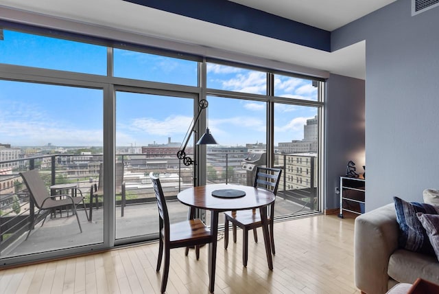 106 W Seeboth St Unit 702, Milwaukee, WI 53204 - dining area with wood finished floors and a city view