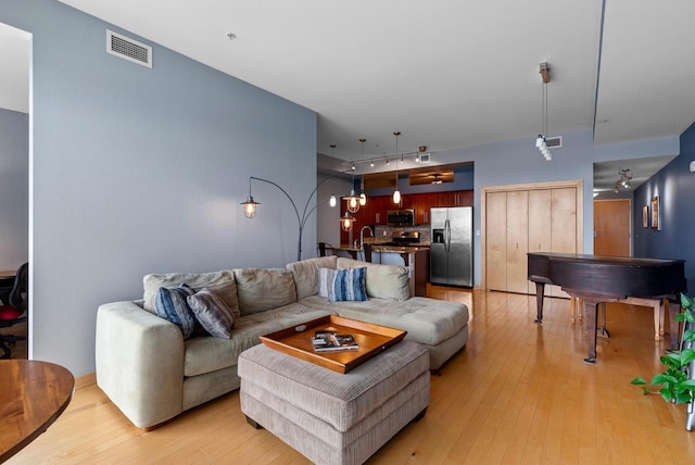 106 W Seeboth St Unit 702, Milwaukee, WI 53204 - living room with light wood-style flooring