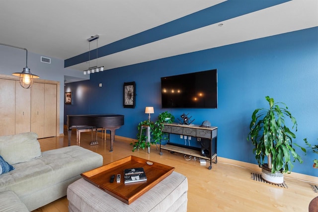 106 W Seeboth St Unit 702, Milwaukee, WI 53204 - living area featuring wood finished floors and baseboards