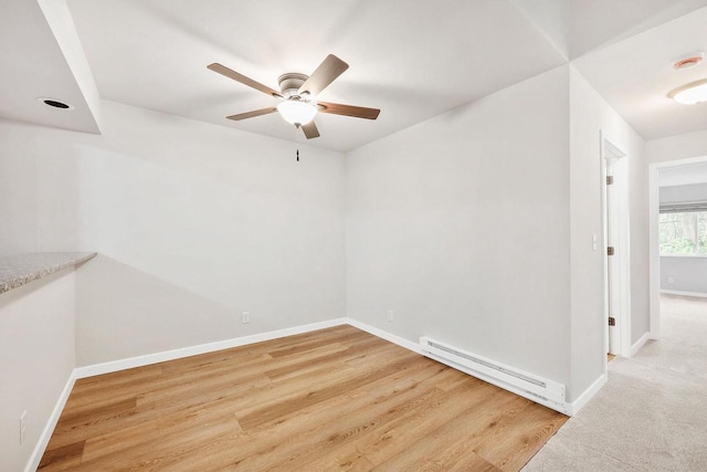 1508 Whispering Pines Way, Fitchburg, WI 53713 - empty room with a baseboard radiator, ceiling fan, light wood finished floors, and a smoke detector