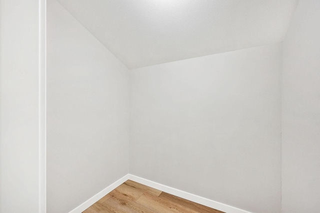 1508 Whispering Pines Way, Fitchburg, WI 53713 - unfurnished room with lofted ceiling and light wood-style flooring