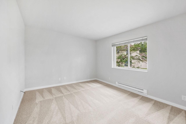 1508 Whispering Pines Way, Fitchburg, WI 53713 - spare room featuring a baseboard radiator and carpet